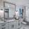 Atlanta, GA Luxury Apartments - Mira at Midtown Union - Luxury Bathrooms With Granite Countertops, Large Vanity Mirror, Walk In Closet, Tile Flooring, And Shower With Tub Combo.