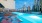 Apartments For Rent In Atlanta, GA - Mira at Midtown Union - Oversized Pool With Lavish Lounge Chairs, Tables, Luxury Light Fixtures, and Views Of Midtown.