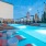 Apartments For Rent In Atlanta, GA - Mira at Midtown Union - Oversized Pool With Lavish Lounge Chairs, Tables, Luxury Light Fixtures, and Views Of Midtown.
